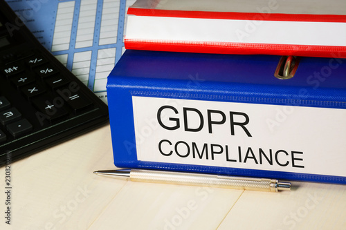 GDPR compliance. General Data Protection Regulation - 25 May 2018. Personal data safety, cyber privacy and security in Euorope. Folders with documentation, calculator, pen on table photo