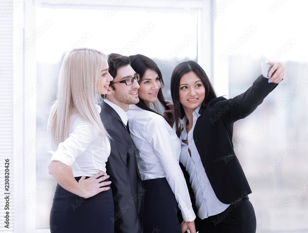 smiling business team takes a selfie to commemorate the seminar. smiling business team takes a selfie to commemorate the seminar.