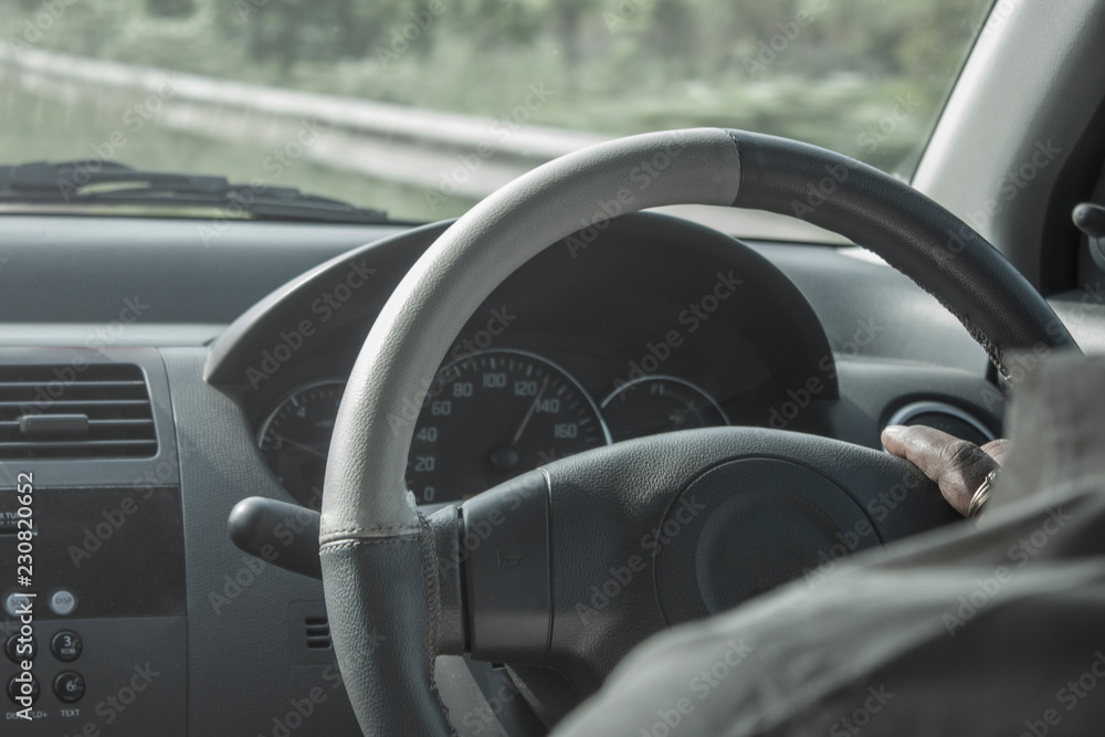 Interior view of a man driving his car