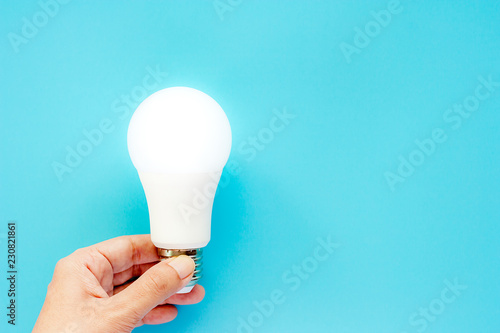 Hand holding glowing LED li...
