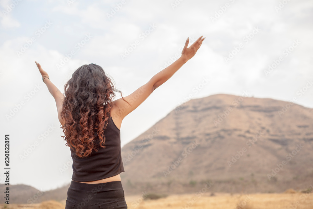 Asian girls spread their hands in the sky to show their happiness and victory with the concept of life and success on the sky in the morning. The silhouette of the girl raised her hand to thank God. Asian girls spread their hands in the sky to show their happiness and victory with the concept of life and success on the sky in the morning. The silhouette of the girl raised her hand to thank God.