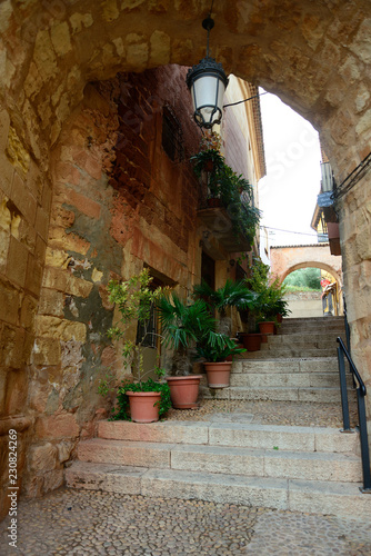 Fototapeta Naklejka Na Ścianę i Meble -  Alcaraz, Spain - October 21, 2018: Detail of the arch and facade near the Town Hall of Alcaraz.