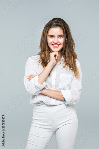 Portrait of young businesswoman hold her finger at her chin, hard decision, studio shoot isolated on white background