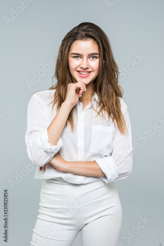 Portrait of young businesswoman hold her finger at her chin, hard decision, studio shoot isolated on white background