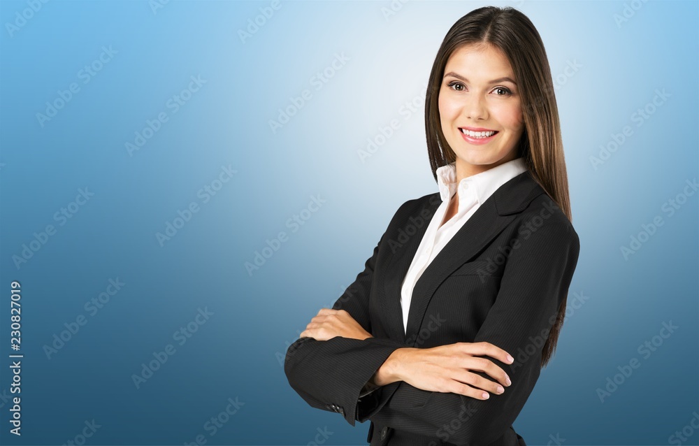 Young businesswoman in suit on blurred background Young businesswoman in suit on blurred background