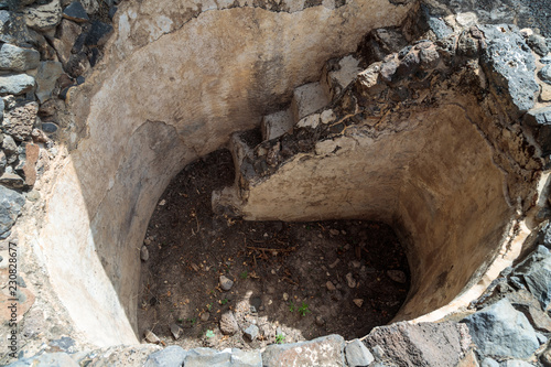 Remains  of bath for ritual ablutions - Mikvah - in ruins of the ancient Jewish city of Gamla on the Golan Heights destroyed by the armies of the Roman Empire in the 67th year AD photo