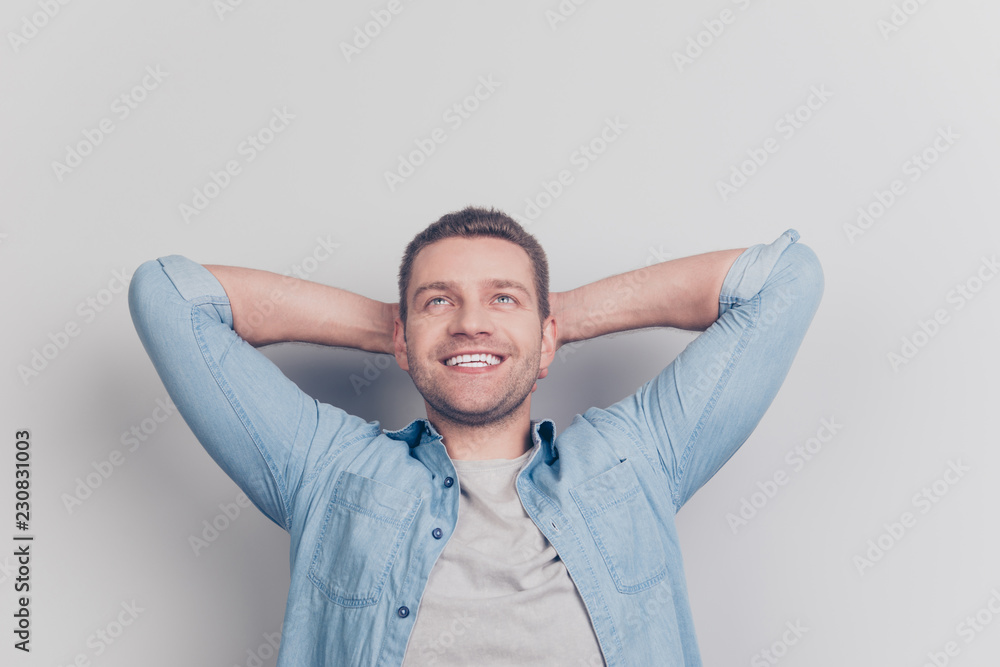 Close up portrait of fun joy gentle man look up hold hands above Close up portrait of fun joy gentle man look up hold hands above