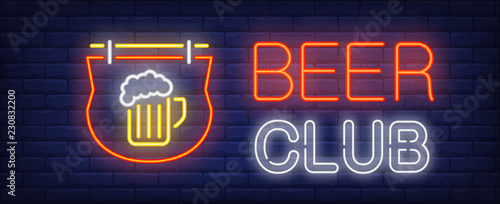 Beer club neon sign. Glowing neon inscription with neon outdoor sign with beer cup on dark blue brick background. Can be used for night advertisement, pubs, clubs