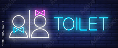 Toilet neon sign. Glowing neon inscription with boy and girl figures on dark blue brick background. Can be used for night outdoor banners, advertisement, night clubs