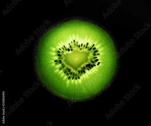 macro photography of a cutted half kiwi with light effects