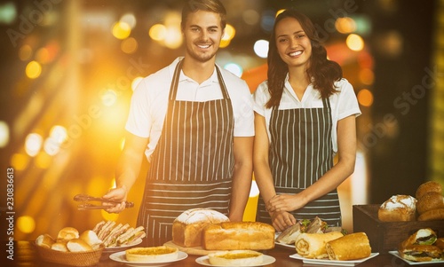 Composite image of portrait of coworker standing by table with photo