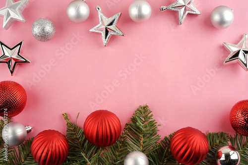 Merry Christmas. Christmas ornaments creatively arranged across the frame. Seasons greetings. Flat lay or top view.