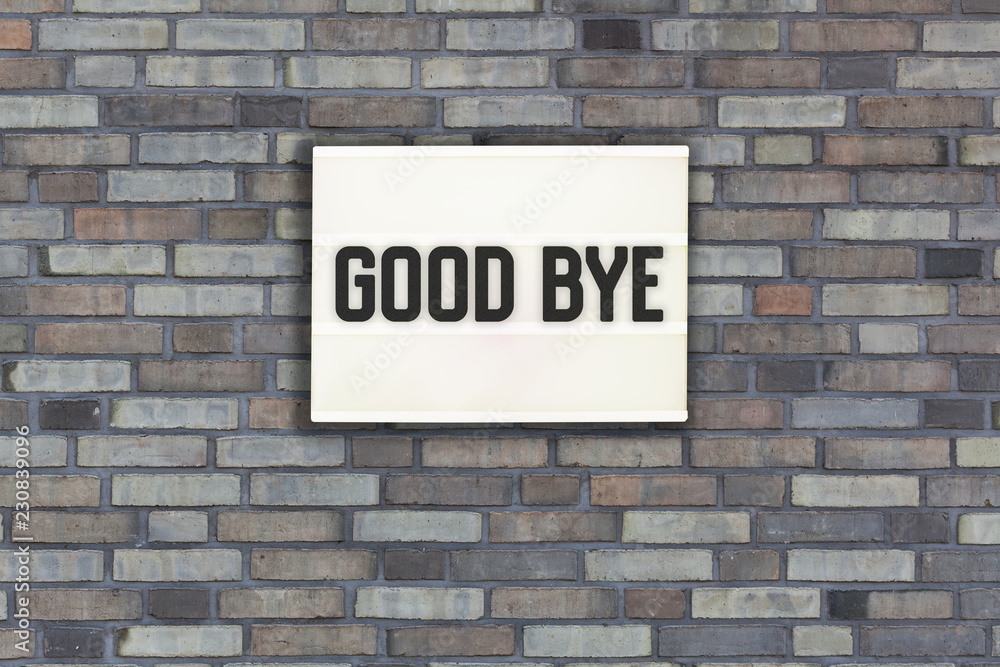 Fototapeta premium Good bye in light box on brick wall