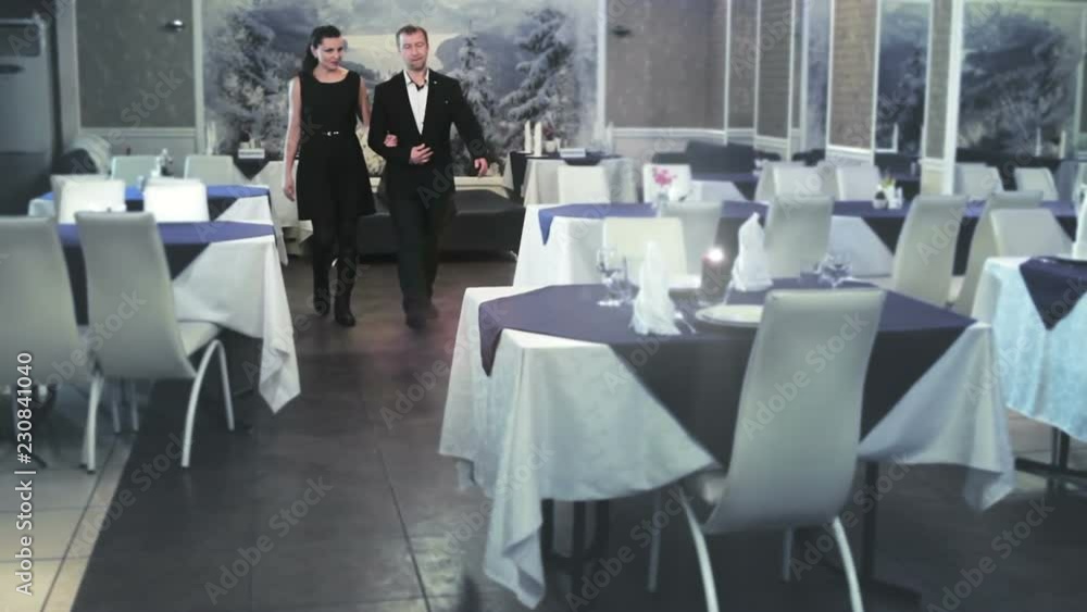 a middle-aged couple comes to a cafe a middle-aged couple comes to a cafe