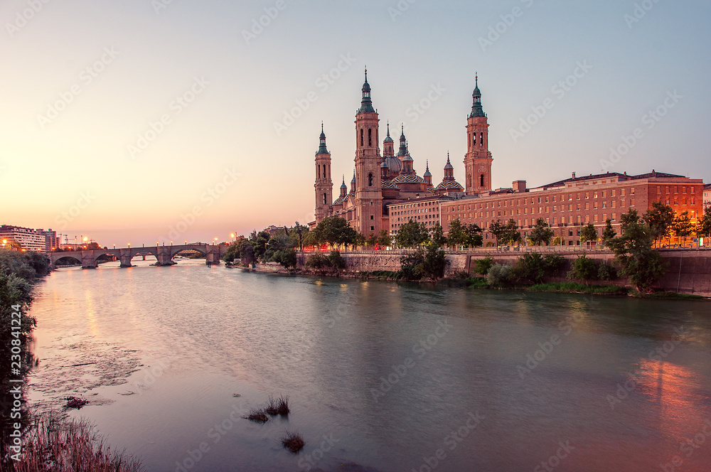 Beautiful sunrise landscape in Zaragoza. Spain. Aragon.  Basilica of Our Lady of the Pillar in Zaragoza and Ebro River.