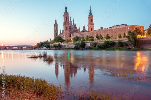 Beautiful sunrise landscape in Zaragoza. Spain. Aragon. Basilica of Our Lady of the Pillar in Zaragoza and Ebro River.