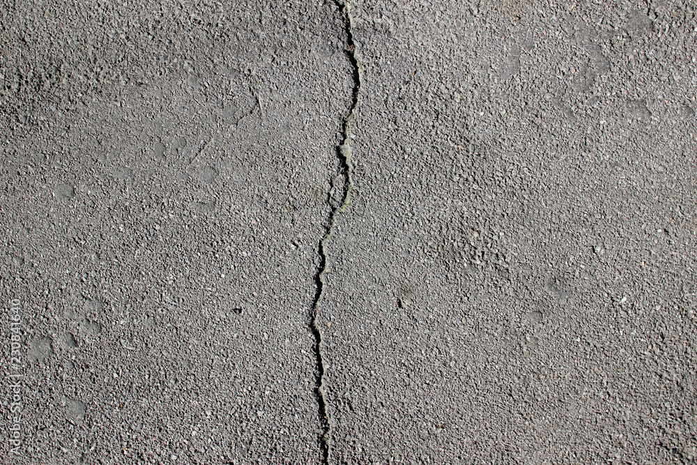 Obraz premium Street asphalt pavement surface texture with cracks