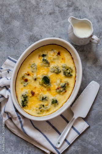 gratin with broccoli in white oval shape with béchamel sauce