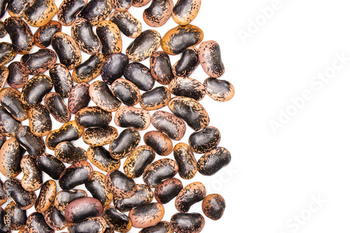 Lot of whole speckled colored butter beans painted lady scarlet runner variety flatlay isolated on white background photo