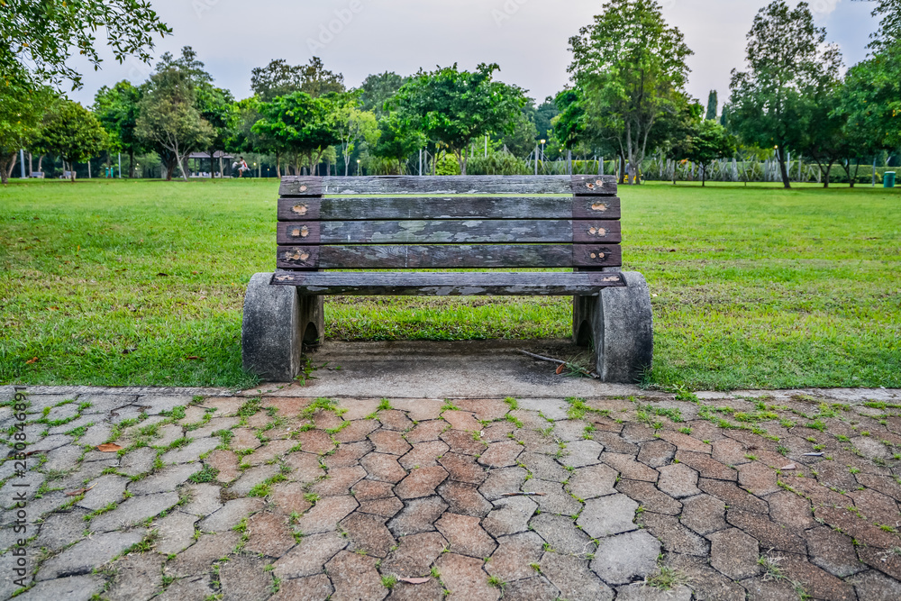 Old style stone park benches in a beach in Pasir Ris Singapore Stock