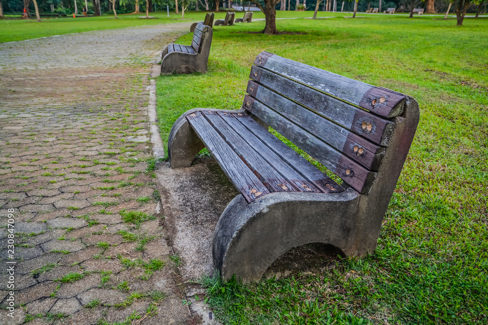 Old style stone park benches in a beach in Pasir Ris Singapore