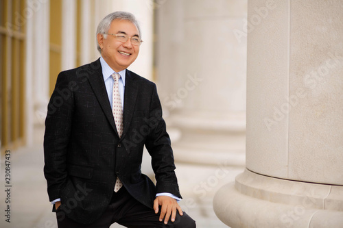 Asian aged man. Businessman model with watches