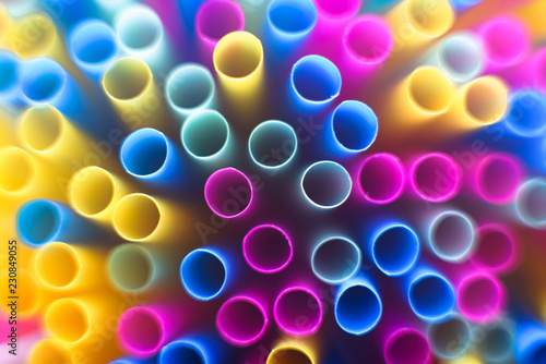 Macro shot of plastic straws top down.