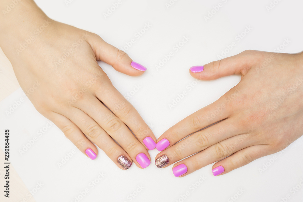 Nail varnishing in white color. Manicure, pedicure beauty salon concept. Empty place for text or logo.