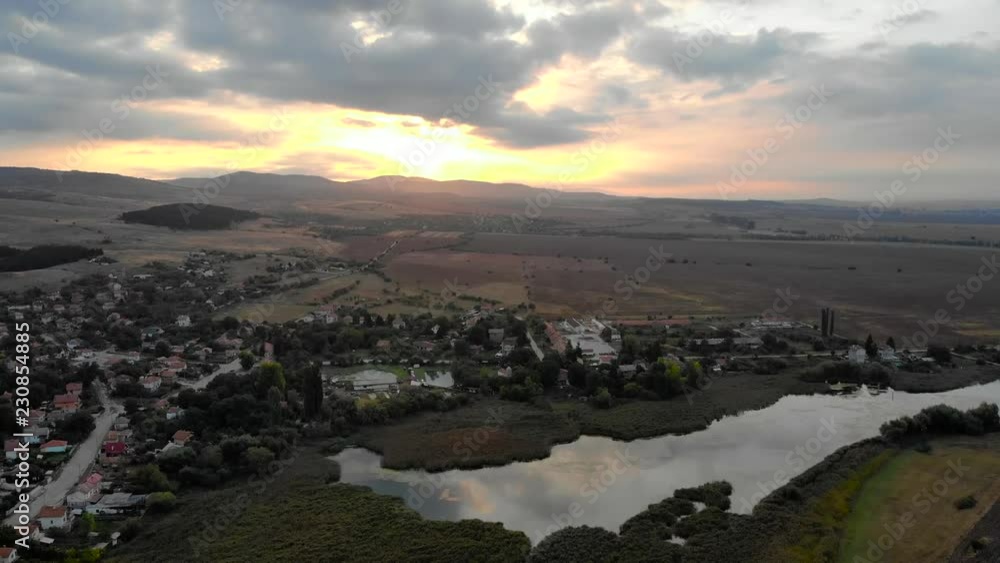Beautiful sunrise above Bulgarian village in summer, Aerial view. Beautiful sunrise above Bulgarian village in summer, Aerial view.