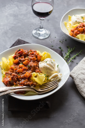 Pappardelle pasta with meat ragout and burrata cheese