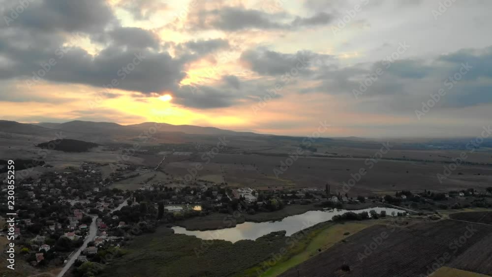 Beautiful sunrise above Bulgarian village in summer, Aerial view. Beautiful sunrise above Bulgarian village in summer, Aerial view.