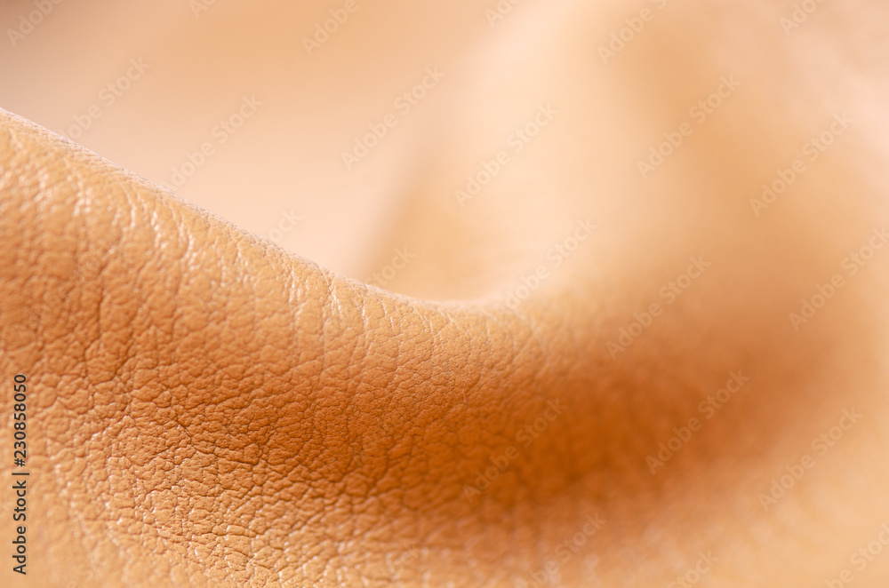 Fototapeta premium Beige yellow leather material fabric nature on blur background