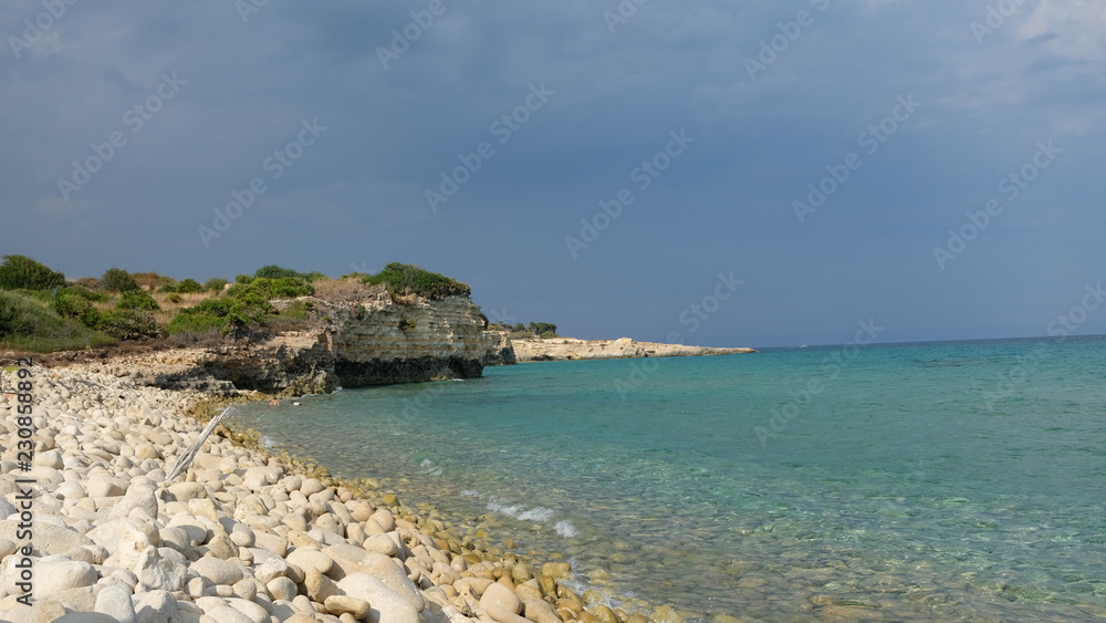 Amazing beach at the Ionian Sea, in the province of Syracuse, Sicily. The beach is part of the Oriented Nature Reserve Cavagrande.
