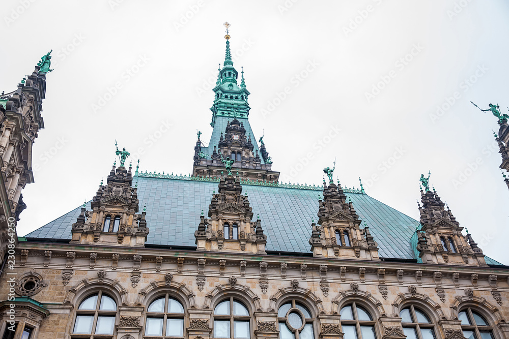 Hamburg City Hall building located in the Altstadt quarter in the city center at the Rathausmarkt square in a cold rainy early spring day Hamburg City Hall building located in the Altstadt quarter in the city center at the Rathausmarkt square in a cold rainy early spring day