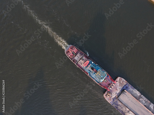 View from the height of a floating ship on the river, around the forest © dmitriydanilov62