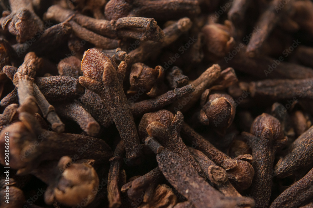 closeup of cloves pile on full frame background closeup of cloves pile on full frame background