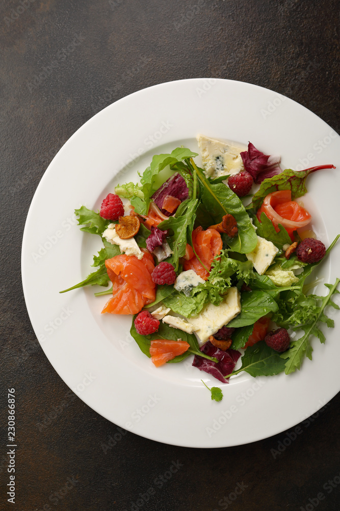 Fresh salad with salmon and cheese top view Fresh salad with salmon and cheese top view