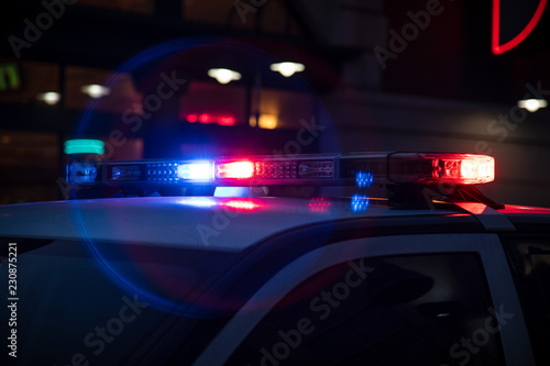 Police Lights Flashing on Dark Street