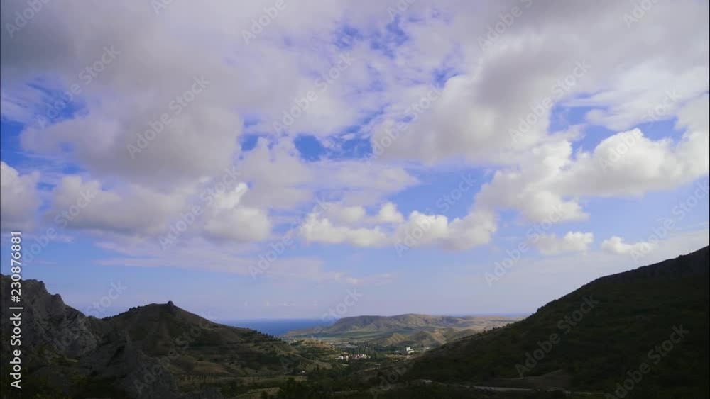 Mountains against the blue sky with white clouds. Cirrus clouds run across the blue sky. best types of mountain ranges. Beautiful view of the mountains. best video of steep cliffs. Mountains against the blue sky with white clouds. Cirrus clouds run across the blue sky. best types of mountain ranges. Beautiful view of the mountains. best video of steep cliffs.