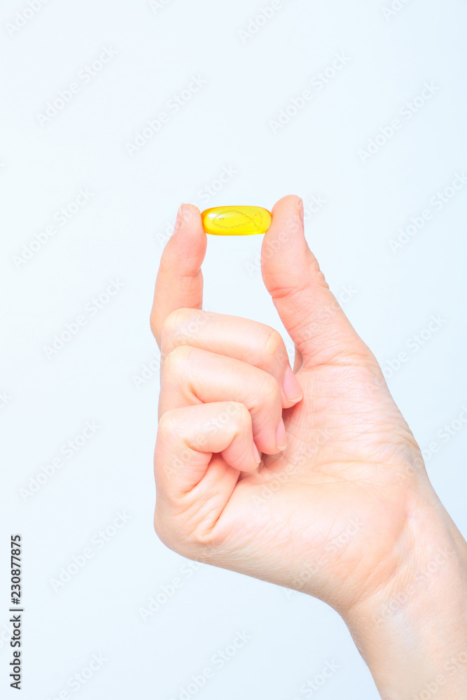 Nutrition. Healthy Lifestyle. Woman Holding Capsule With Fish Oil Omega-3. Supplements, Vitamins. Nutrition. Healthy Lifestyle. Woman Holding Capsule With Fish Oil Omega-3. Supplements, Vitamins.