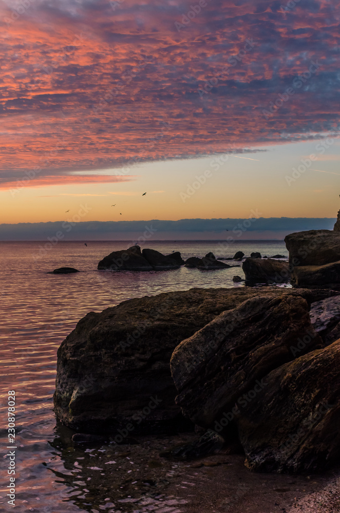Seascape in Odesa during the sunrise in the autumn season Seascape in Odesa during the sunrise in the autumn season