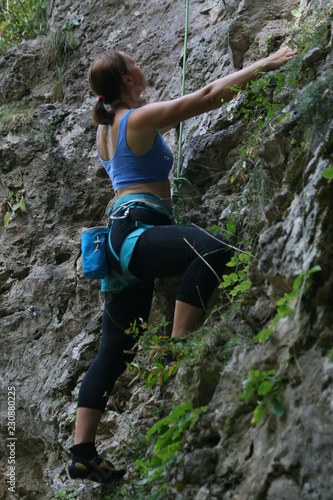 Young female climber. Guamka, Russia.