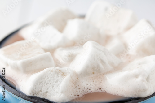 hot cocoa or coffee with marshmallow closeup