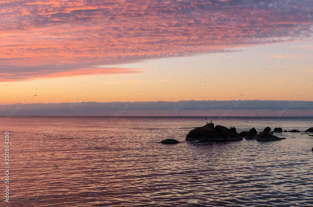 Seascape in Odesa during the sunrise in the autumn season Seascape in Odesa during the sunrise in the autumn season