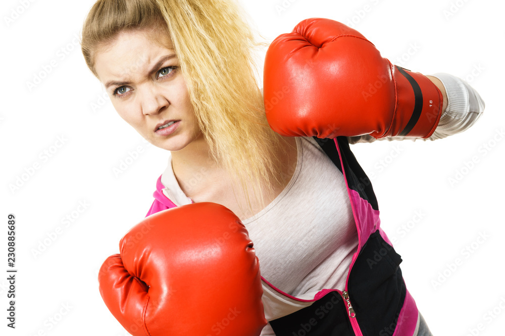 Angry woman wearing boxing gloves Angry woman wearing boxing gloves