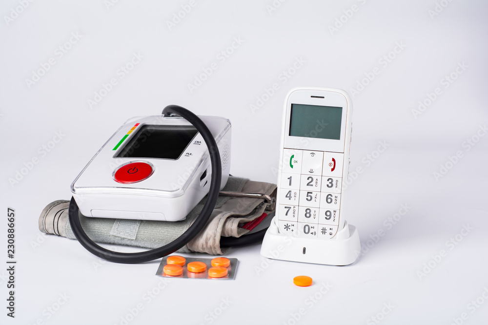 white electronic tonometer with phone and tablets white electronic tonometer with phone and tablets