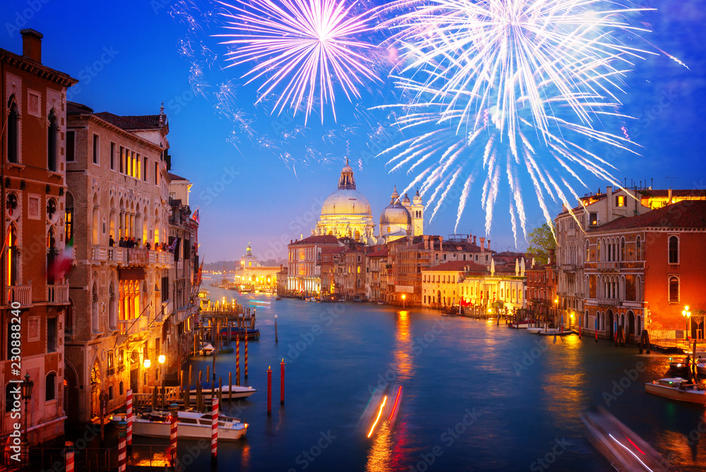 Grand canal and Basilica Santa Maria della Salute at night with fireworks, Venice, Italy, toned