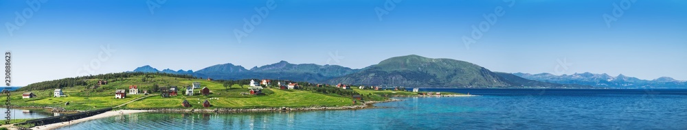 Fototapeta premium Picturesque panoramic view of houses in Holdoya Island which is part of Lofoten archipelago in Norway. The landscape of Norway in the summer.