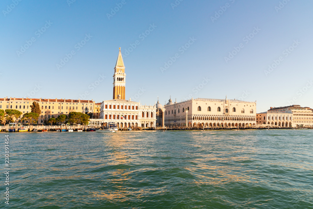 view of famous San Marco square embankment and lagoon waterfront at sunny spring day, Venice cityline, Italy
