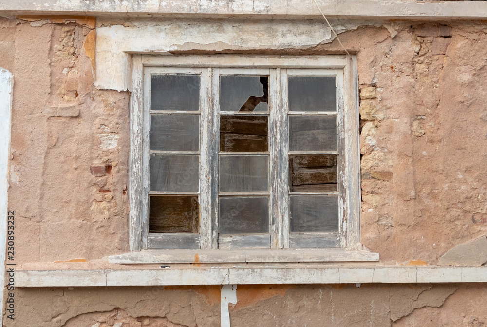 Old house with a broken window